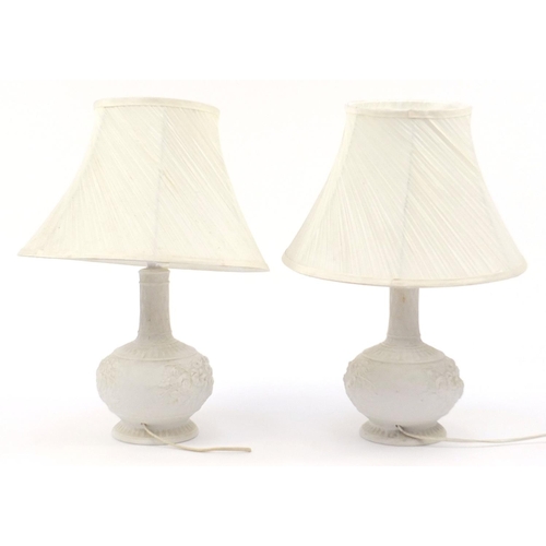 2095 - Pair of parian porcelain floral table lamps with silk lined shades, each 50cm high