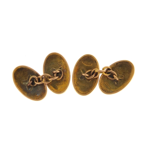 323 - Pair of 9ct gold cufflinks with engine turned decoration housed in a fitted tooled leather box, hall... 