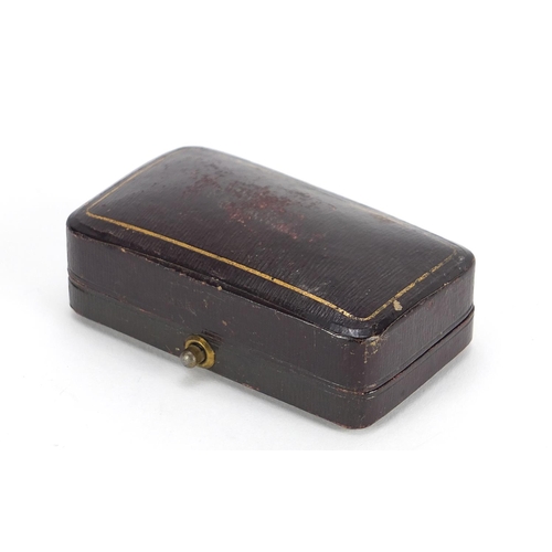 323 - Pair of 9ct gold cufflinks with engine turned decoration housed in a fitted tooled leather box, hall... 