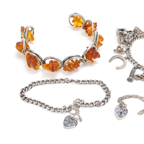 737 - Silver jewellery comprising an amber bracelet, charm bracelet with charms and two love heart bracele... 