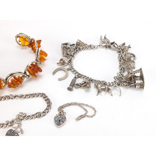 737 - Silver jewellery comprising an amber bracelet, charm bracelet with charms and two love heart bracele... 