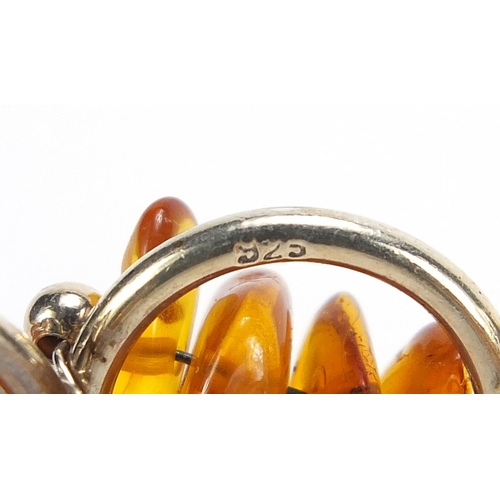 737 - Silver jewellery comprising an amber bracelet, charm bracelet with charms and two love heart bracele... 