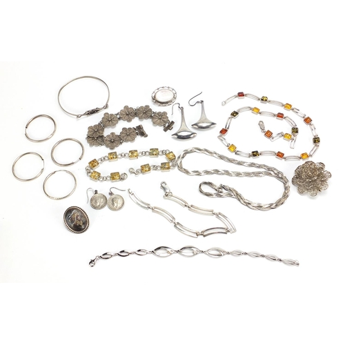 1823 - Silver jewellery including amber coloured necklace, hardstone brooches, bracelets and a pair of thre... 