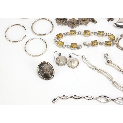 1823 - Silver jewellery including amber coloured necklace, hardstone brooches, bracelets and a pair of thre... 