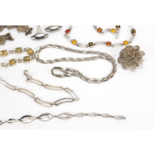 1823 - Silver jewellery including amber coloured necklace, hardstone brooches, bracelets and a pair of thre... 