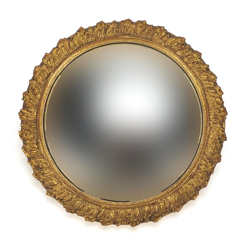 2083 - Circular gilt framed convex wall mirror, 31cm in diameter