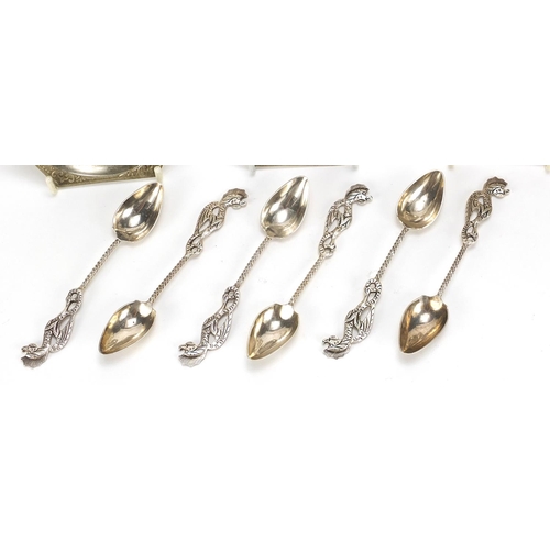 894 - Set of six silver coloured metal seahorse design teaspoons and three silver plated dishes, the spoon... 