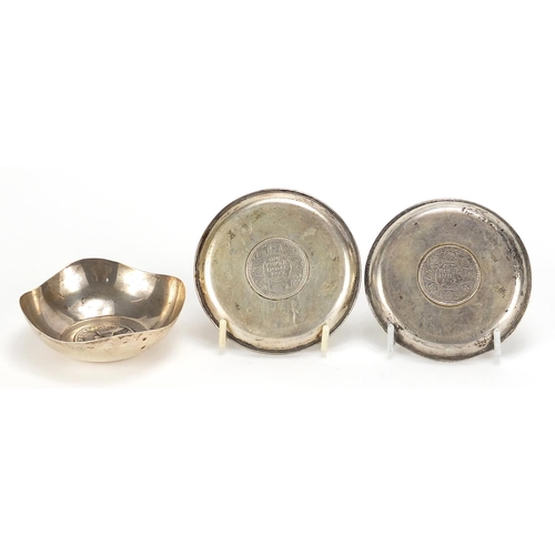 556 - Three Indian silver one rupee coin set dishes comprising 1901, 1917 and 1917, the largest 8.5cm in d... 