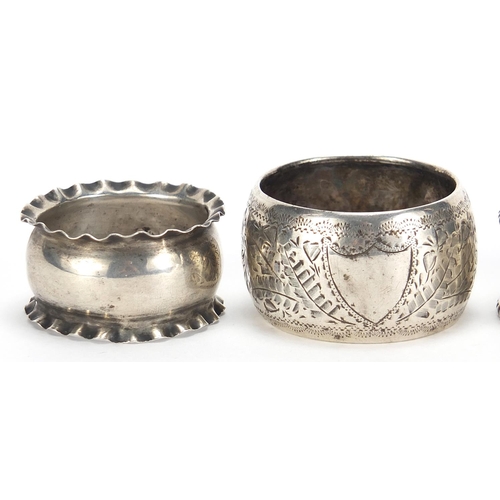 87 - Four Victorian and later silver napkin rings including a pair by Thomas Hayes, Birmingham 1905, the ... 