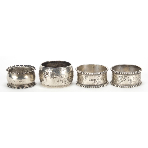 87 - Four Victorian and later silver napkin rings including a pair by Thomas Hayes, Birmingham 1905, the ... 