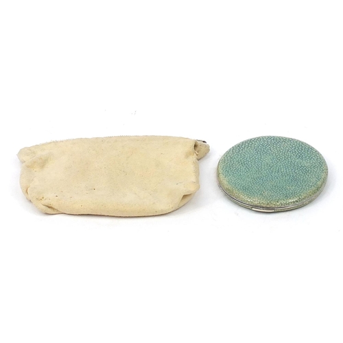 124 - Antique white metal and shagreen mounted powder compact housed in a Chamois leather case, 9.5cm in l... 