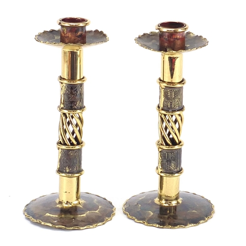 2553 - Pair of Arts & Crafts design brass candlesticks, each 17cm high