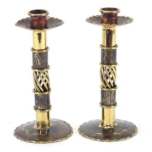 2553 - Pair of Arts & Crafts design brass candlesticks, each 17cm high