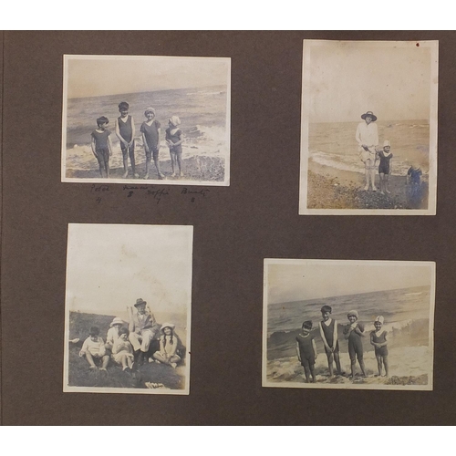 2550 - Early 20th century black and white photographs arranged in an album including Kent cricket, Ice skat... 