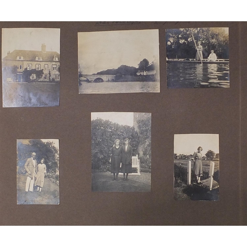 2550 - Early 20th century black and white photographs arranged in an album including Kent cricket, Ice skat... 