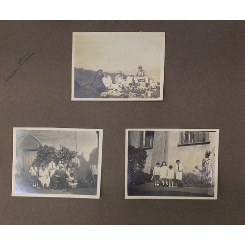 2550 - Early 20th century black and white photographs arranged in an album including Kent cricket, Ice skat... 