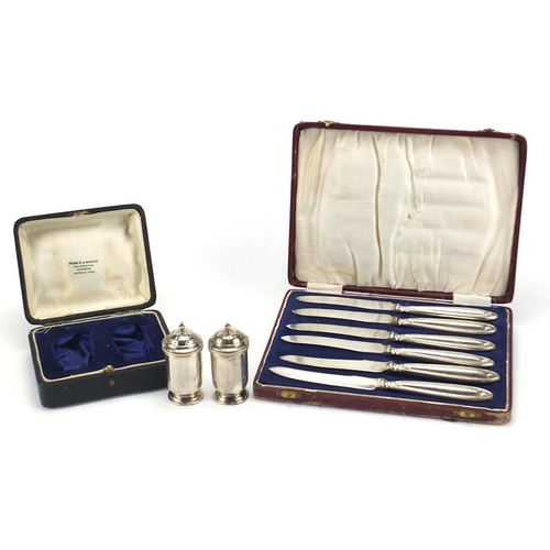1125 - Pearce & Sons, pair of casters and a set of six silver handled butter knives, each with fitted cases... 