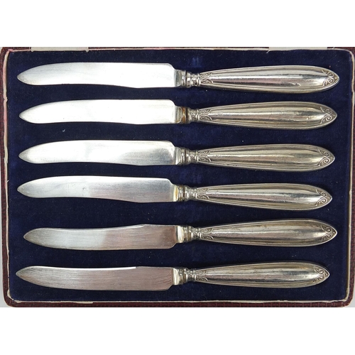 1125 - Pearce & Sons, pair of casters and a set of six silver handled butter knives, each with fitted cases... 