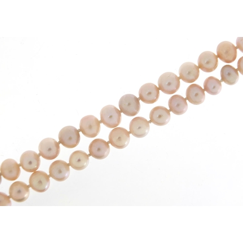 1854 - Freshwater pearl necklace, 120cm in length, each pearl approximately 7mm in diameter, 87.0g