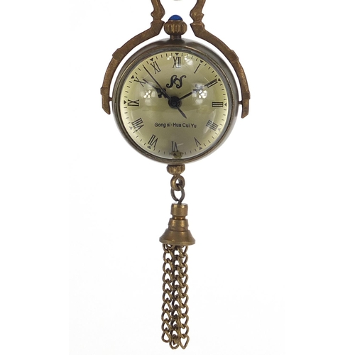 1824 - Globular glass and brass fob watch with tassel, 8cm high