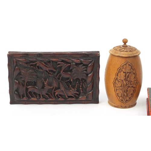 2091 - Indian woodenware including a workbox decorated with a female in traditional dress and plaque carved... 