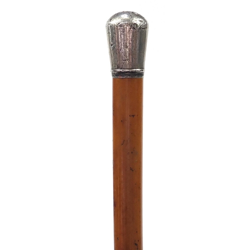 873 - Malacca sword stick with silver pommel and steel blade, 91cm in length