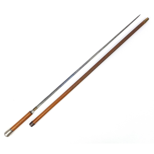 873 - Malacca sword stick with silver pommel and steel blade, 91cm in length