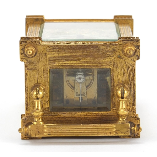 77 - 19th century gilt brass carriage clock with foliate fret panels and enamelled chapter ring having Ar... 