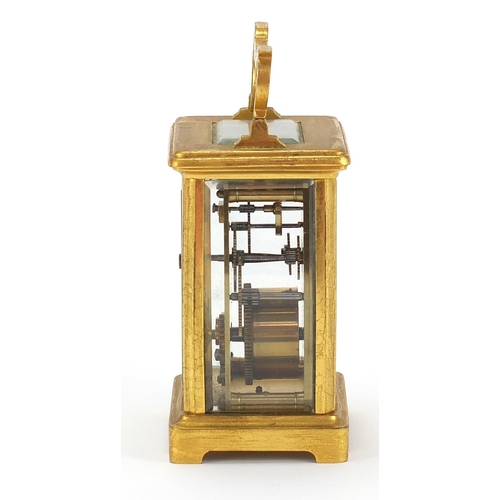 615 - Brass cased carriage clock with enamel dial and Roman numerals, 11.5cm high