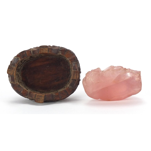 257 - Chinese rose quartz carving of Buddha raised on a carved hardwood stand, 5.5cm wide