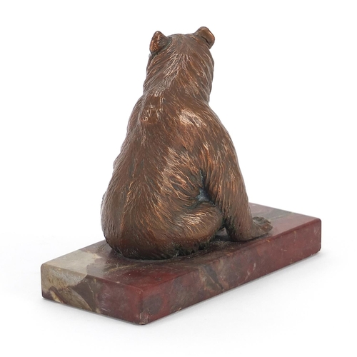 201 - Art Deco patinated bear design desk weight raised on a rectangular marble base, 13.5cm in length