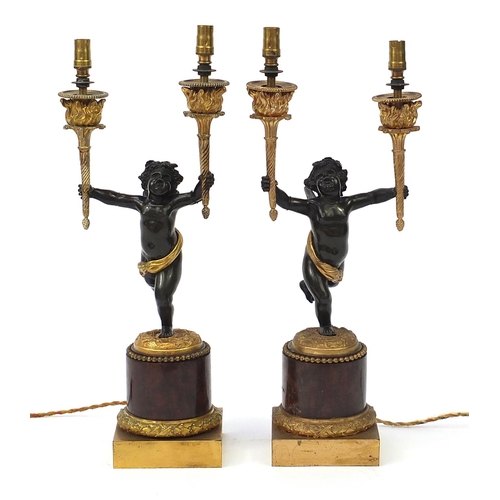 33 - Pair of 19th century ormolu and marble Putti design two branch candelabras converted to electric tab... 