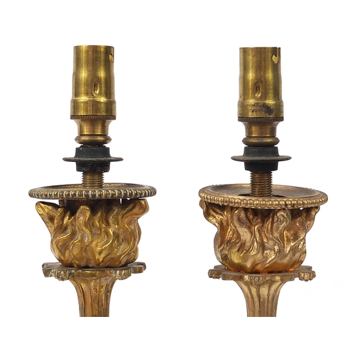 33 - Pair of 19th century ormolu and marble Putti design two branch candelabras converted to electric tab... 