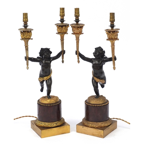 33 - Pair of 19th century ormolu and marble Putti design two branch candelabras converted to electric tab... 
