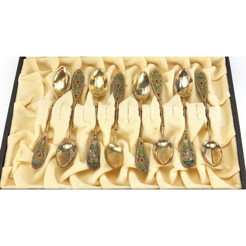 669 - Johan G Kjaerland, set of eight Norwegian silver gilt and plique à jour enamel teaspoons housed in a... 