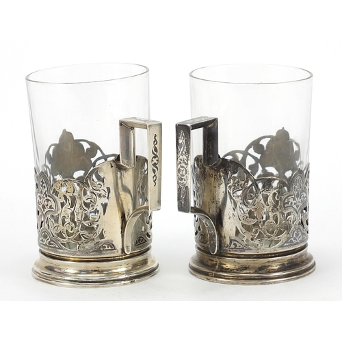 671 - Pair of silver niello work cup holders, impressed Russian marks to the base, 9.5cm high excluding th... 