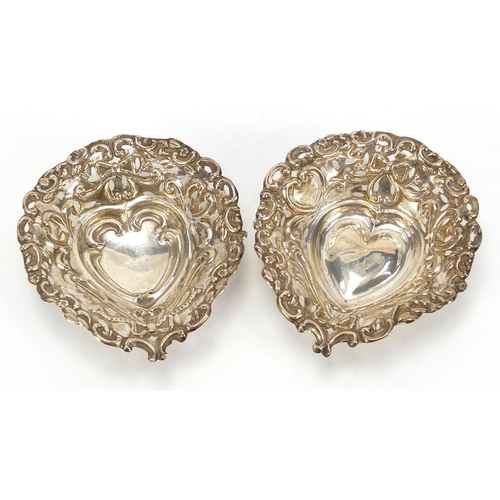 206 - M Bros, two Victorian silver love heart dishes, pierced and embossed with swags and bows, Birmingham... 