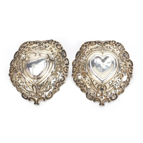 206 - M Bros, two Victorian silver love heart dishes, pierced and embossed with swags and bows, Birmingham... 