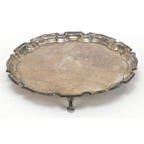 426 - Adie Brothers Ltd, George VI circular three footed salver raised on three hoof feet, Birmingham 1937... 