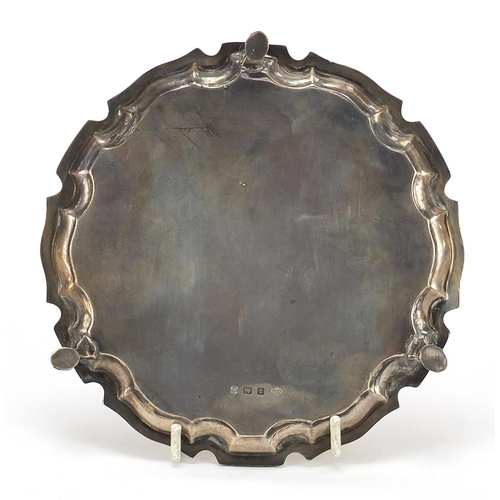 426 - Adie Brothers Ltd, George VI circular three footed salver raised on three hoof feet, Birmingham 1937... 