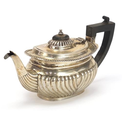 88 - Thomas Hayes, Victorian silver teapot with demi fluted body and ebonised handle and knop, London 189... 