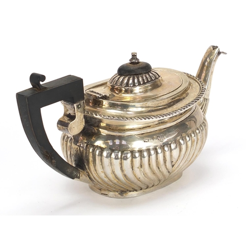 88 - Thomas Hayes, Victorian silver teapot with demi fluted body and ebonised handle and knop, London 189... 