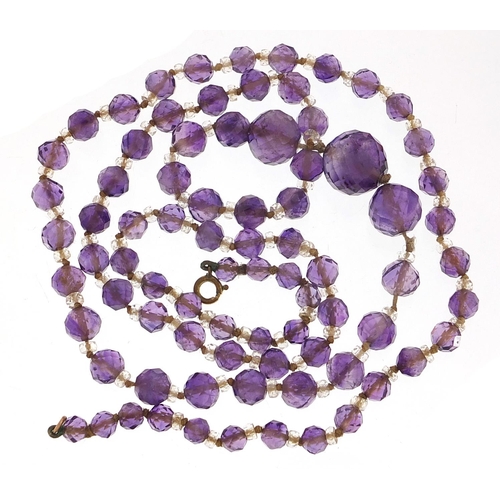 2027 - Vintage graduated amethyst and crystal bead necklace, 80cm in length, 50.2g