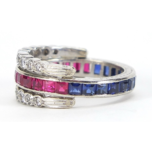 592 - Unmarked white metal triple eternity hinged ring set with rubies, blue sapphires and white sapphires... 