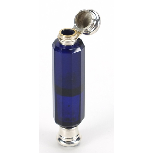 135 - Victorian blue glass double end scent bottle with unmarked silver mounts, 10.5cm in length