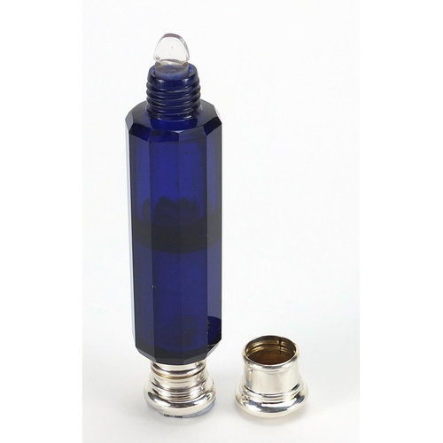 135 - Victorian blue glass double end scent bottle with unmarked silver mounts, 10.5cm in length