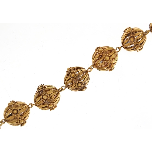 1780 - Unmarked gilt metal filigree ball bracelet, 20cm in length, 31.2g