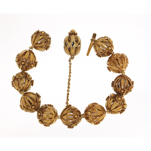 1780 - Unmarked gilt metal filigree ball bracelet, 20cm in length, 31.2g