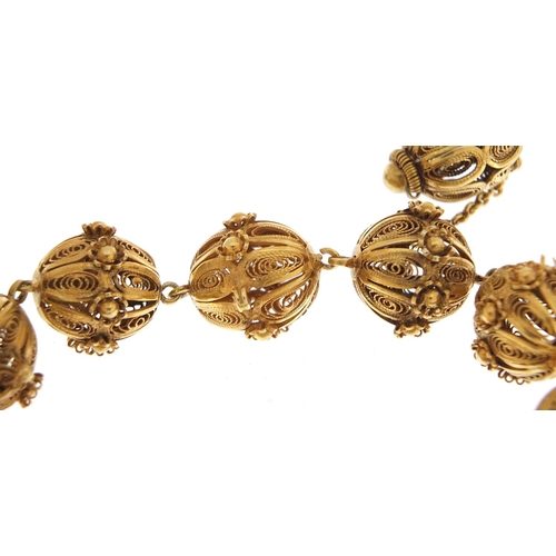 1780 - Unmarked gilt metal filigree ball bracelet, 20cm in length, 31.2g