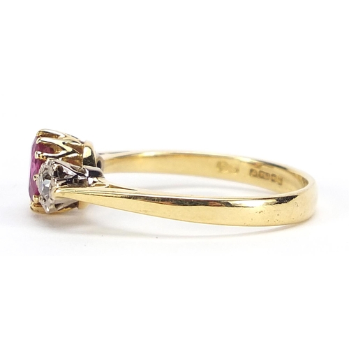 625 - 18ct gold ruby and diamond three stone ring, size Q, 3.7g